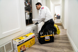 HVAC tech performing a furnace tune-up in Jacksonville, FL home
