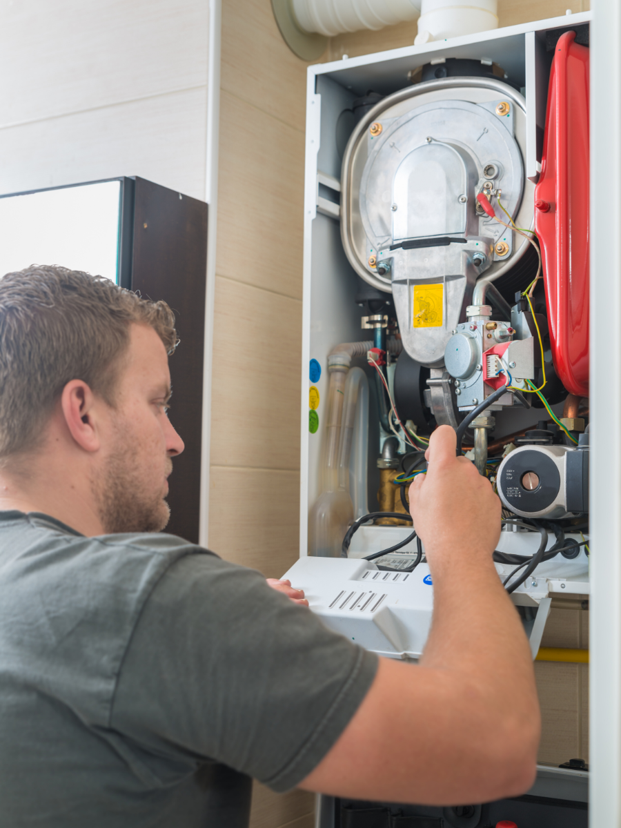 HVAC tech working on a limit switch 