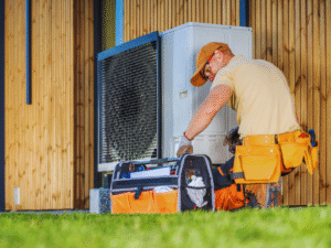 HVAC professional fixing a short cycling heat pump