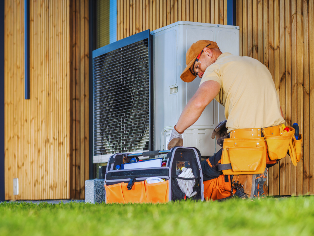 HVAC professional fixing a short cycling heat pump