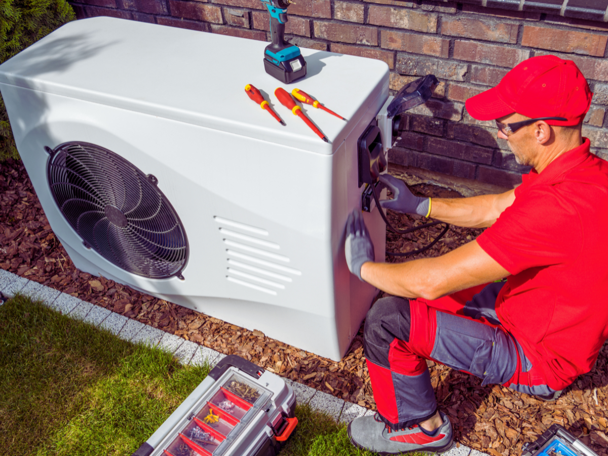 HVAC tech repairing common heat pump issue for Jacksonville, FL homeowner
