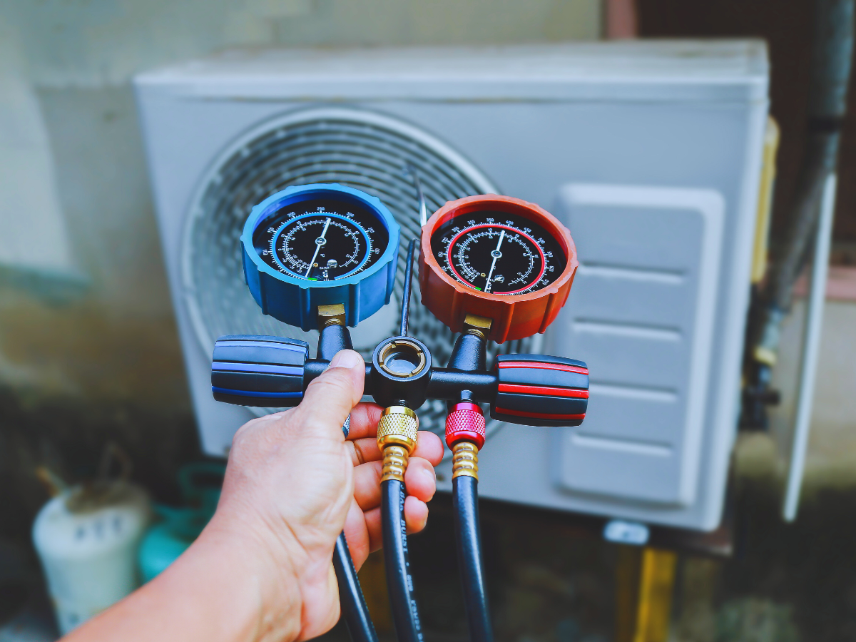 HVAC tech testing for refrigerant leak